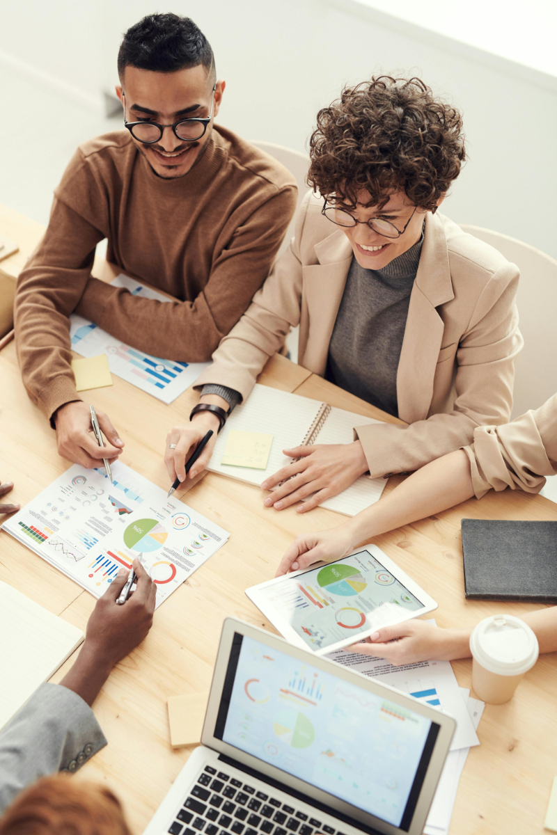 Team discusses charts and figures during a work meeting.
